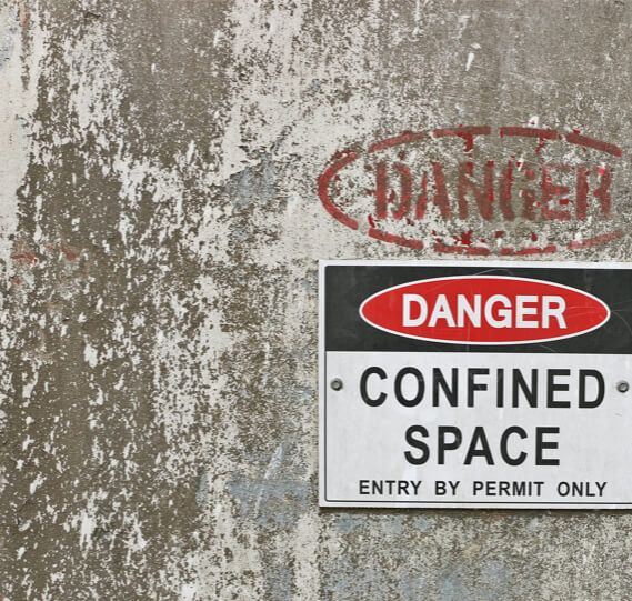 A danger sign in front of a confined space