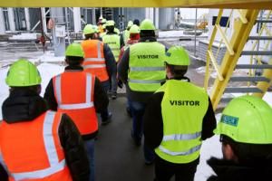 employees and visitors at facility wearing ppe