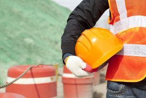 worker with vest and hard hat