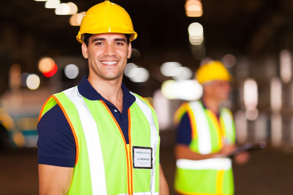 A warehouse employee smiles after receiving safety awareness courses