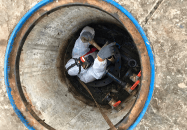 A worker inside a confined space